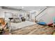 Finished basement features hardwood floors, projector screen, and recreational spaces at 5990 Hollow Ct, Bargersville, IN 46106