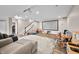 Spacious finished basement area with projector, screen, and stairs to upper level at 5990 Hollow Ct, Bargersville, IN 46106