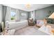 Bedroom with a neutral color scheme featuring natural light, a daybed, and a changing table at 5990 Hollow Ct, Bargersville, IN 46106