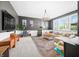 Spacious bonus room featuring comfortable seating, large windows and a television at 5990 Hollow Ct, Bargersville, IN 46106