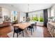 Open-concept dining room features hardwood floors and views of the living room and outdoors at 5990 Hollow Ct, Bargersville, IN 46106