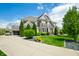 Charming two-story home featuring a three-car garage, landscaped front yard, and manicured lawn at 5990 Hollow Ct, Bargersville, IN 46106