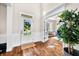 Bright foyer with hardwood floors, wainscoting, and view of an office space at 5990 Hollow Ct, Bargersville, IN 46106