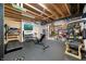 Basement gym features exposed wood ceiling, workout machines, and weight racks at 5990 Hollow Ct, Bargersville, IN 46106