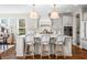 Stylish kitchen island with pendant lighting and seating in a modernly designed kitchen at 5990 Hollow Ct, Bargersville, IN 46106