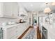Well-equipped kitchen with white cabinetry, modern appliances, and elegant countertops at 5990 Hollow Ct, Bargersville, IN 46106