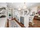 Spacious kitchen featuring an island, modern appliances, and seamless layout at 5990 Hollow Ct, Bargersville, IN 46106