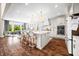 Bright, modern kitchen with a large island, stainless steel appliances, and ample counter space at 5990 Hollow Ct, Bargersville, IN 46106