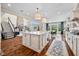 Open concept kitchen with an island, fireplace, and seamless transition to the living area at 5990 Hollow Ct, Bargersville, IN 46106