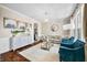 Inviting living room features a cozy sofa, blue chairs, and tasteful decor creating a warm atmosphere at 5990 Hollow Ct, Bargersville, IN 46106