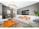 Inviting living room featuring a chandelier, flat-screen TV, and neutral decor at 5990 Hollow Ct, Bargersville, IN 46106