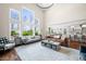 Bright living room with soaring ceilings, large windows, and modern furnishings at 5990 Hollow Ct, Bargersville, IN 46106