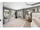 Well-lit main bedroom offering ample space and a cozy sitting area at 5990 Hollow Ct, Bargersville, IN 46106