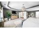 Bright main bedroom featuring a tray ceiling, elegant furniture, and modern decor at 5990 Hollow Ct, Bargersville, IN 46106