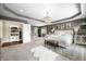 Luxurious main bedroom featuring a tray ceiling, neutral decor, and bright natural light at 5990 Hollow Ct, Bargersville, IN 46106