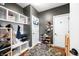 Mudroom with built in storage, seating and hardwood floors at 5990 Hollow Ct, Bargersville, IN 46106