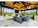 Beautiful outdoor kitchen featuring a fireplace, comfortable seating, and grill, great for outdoor entertaining at 5990 Hollow Ct, Bargersville, IN 46106