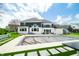 A stunning rear exterior featuring a pool, a well-manicured lawn, and a modern two-story home with large windows at 5990 Hollow Ct, Bargersville, IN 46106