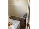 Bedroom featuring wall paneling and carpeted floors at 616 N Exeter Ave, Indianapolis, IN 46222