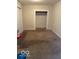 Bedroom showcasing neutral carpeting, a doorway, and a large closet at 616 N Exeter Ave, Indianapolis, IN 46222