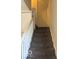 Carpeted stairway with white railing leads to the upper level at 616 N Exeter Ave, Indianapolis, IN 46222