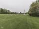 View of the large backyard and brick home at 6494 N Baltimore Rd, Monrovia, IN 46157