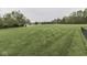 Expansive backyard featuring a lush lawn, shed, and partial fence, offering ample space at 6494 N Baltimore Rd, Monrovia, IN 46157