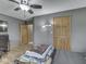Bedroom with hardwood flooring, a ceiling fan, and cozy bedding at 6494 N Baltimore Rd, Monrovia, IN 46157