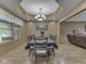 Sophisticated dining room featuring a coffered ceiling and a chandelier for elegant dining at 6494 N Baltimore Rd, Monrovia, IN 46157