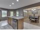 Kitchen island and dining room in an open-concept design with natural light at 6494 N Baltimore Rd, Monrovia, IN 46157