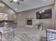 Bright living room with a fireplace, ceiling fan, and comfortable furnishings at 6494 N Baltimore Rd, Monrovia, IN 46157
