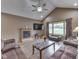 Cozy living room featuring a fireplace, ceiling fan and comfortable seating at 6494 N Baltimore Rd, Monrovia, IN 46157