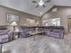 Spacious living room with wood floors, ceiling fan and comfortable seating arrangements at 6494 N Baltimore Rd, Monrovia, IN 46157