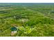Overhead view of 2 acres in Morgantown, Indiana, surrounded by lush forest and mature trees at 680 Unity Church Rd, Morgantown, IN 46160