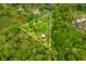 Aerial view of a wooded lot of land with two acre boundary and a house at 680 Unity Church Rd, Morgantown, IN 46160