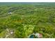 Overhead view of 2 acres in Morgantown, Indiana, with a small pond and mature trees at 680 Unity Church Rd, Morgantown, IN 46160