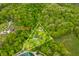 Aerial view of a property with two acres surrounded by trees with a house at 680 Unity Church Rd, Morgantown, IN 46160