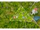 Aerial view of a two acre wooded lot of land with a pond and house at 680 Unity Church Rd, Morgantown, IN 46160