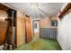 Unfinished basement featuring green carpet and an electrical panel at 680 Unity Church Rd, Morgantown, IN 46160