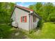 Exterior view of a white sided house with red shutters and red roof at 680 Unity Church Rd, Morgantown, IN 46160