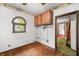 Room featuring overhead cabinets, a small window, and view to another room at 680 Unity Church Rd, Morgantown, IN 46160