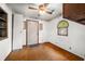 Bright room with natural light and carpet, featuring a ceiling fan at 680 Unity Church Rd, Morgantown, IN 46160