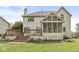 Large backyard featuring a wooden deck, a screened-in porch, and mature trees for privacy at 6818 Bluffridge Dr, Indianapolis, IN 46278
