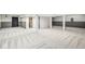Finished basement has an open floor plan and neutral carpeting at 6818 Bluffridge Dr, Indianapolis, IN 46278
