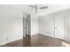 Bright bedroom features laminate floors, ceiling fan, and a doorway at 6818 Bluffridge Dr, Indianapolis, IN 46278