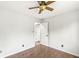 This bedroom offers hardwood floors and a ceiling fan, providing comfort and style at 6818 Bluffridge Dr, Indianapolis, IN 46278