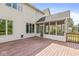 Exterior of home featuring a wooden deck, screened porch and neutral siding at 6818 Bluffridge Dr, Indianapolis, IN 46278