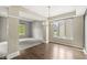 Bright dining space with multiple windows and hardwood floors, perfect for entertaining guests at 6818 Bluffridge Dr, Indianapolis, IN 46278