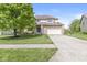 Traditional two-story home with brick and vinyl siding, manicured lawn, and a two-car garage at 6818 Bluffridge Dr, Indianapolis, IN 46278