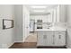 Clean kitchen featuring white cabinetry, stainless steel appliances, and functional layout at 6818 Bluffridge Dr, Indianapolis, IN 46278